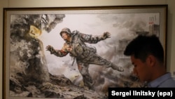 A canvas titled Giving My Priceless Life at an exhibition of North Korean art in Moscow on October 8.<br><br>This painting is one of several in the exhibition depicting North Korean soldiers who were brought in to fight against Ukrainian troops in Russia's war with Kyiv.