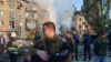 Survivors of the Russian attack left the rubble of their homes with few belongings, some carrying their pets.