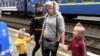 Hard To Leave Home: Ukrainian Parents, Children Evacuate As Front Lines Approach