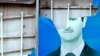 A damaged portrait of Syrian President Bashar al-Assad in the city of Qamishli.